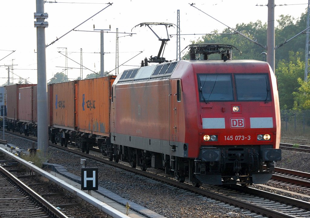 145 073-3 ist am Morgen des 28.07.10 Berlin-Blankenburg Richtung Berliner Innenstadt unterwegs.
