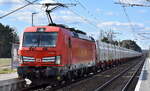 kohle-erz-kalk-und-kokszuege-/912847/db-cargo-ag-mainz-d-mit DB Cargo AG, Mainz [D] mit ihrer Vectron '193 561' [NVR-Nummer: 91 80 6193 561-8 D-DB] und Ganzzug innofreigt Schüttgutbehälter für Kalktransporte kurz vor Ziltendorf EKO Höhe Bahnhof Wiesenau, 08.04.26
