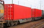 Containerdoppeltragwageneinheit der DB eingestellt mit der Nr. 31 RIV 80 D-DB 4954 433-7 Sggmrs 715, 15.02.11 Bhf. Flughafen Berlin-Schnefeld.
