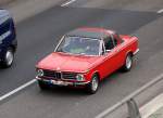 Ein typischer 70r Jahre Vetreter in Sonderbauversion, der BMW 02 (Baureihe 114) in der Form Baur-Targa in rot, produziert wurde dieser zweitrige Mittelklasse-Wagen von 1966-1977, 24.03.10 Berlin