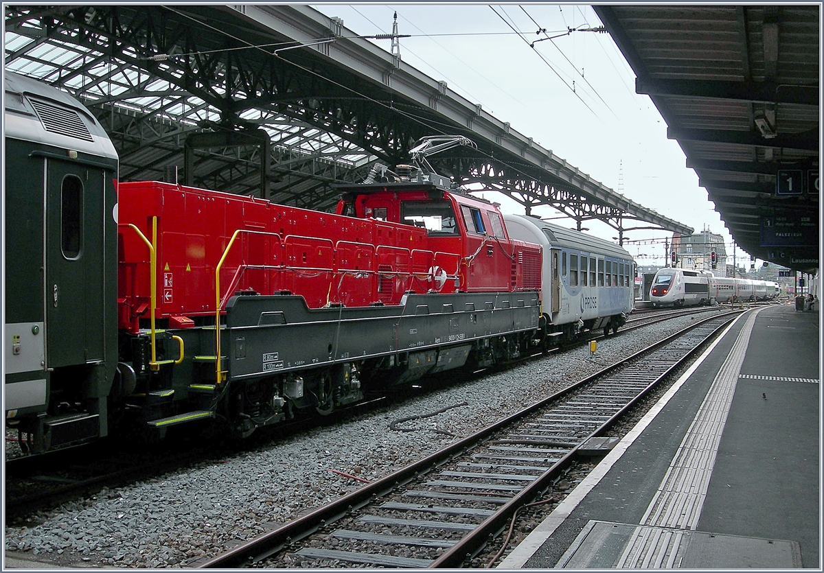 Aem 940 Testfahrten: Da die neue Aem  940 001-1 (UIC 9185 4 940 001-1 CH-SBBI) zwischen den Wagen eingereiht war, konnte sie nur eingeschränkt fotografiert werden.
Lausanne, den 16. Mai 2018