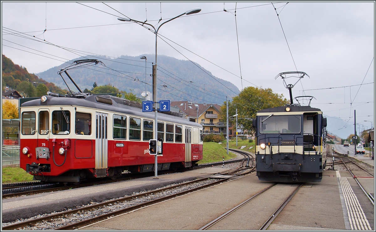 CEV BDeh 2/4 N° 75 und MOB GDe 4/4 in Blonay. 
19. Okt. 2015