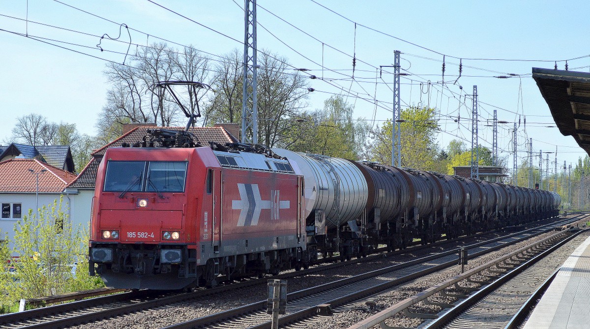HGK/RHC 2051/185 582-4 mit Kesselwagenzug Lt-UN-Nr. 33/1114 für bEnzol-transporte am 17.04.14 Richtung Bernau in Berlin-Karow.