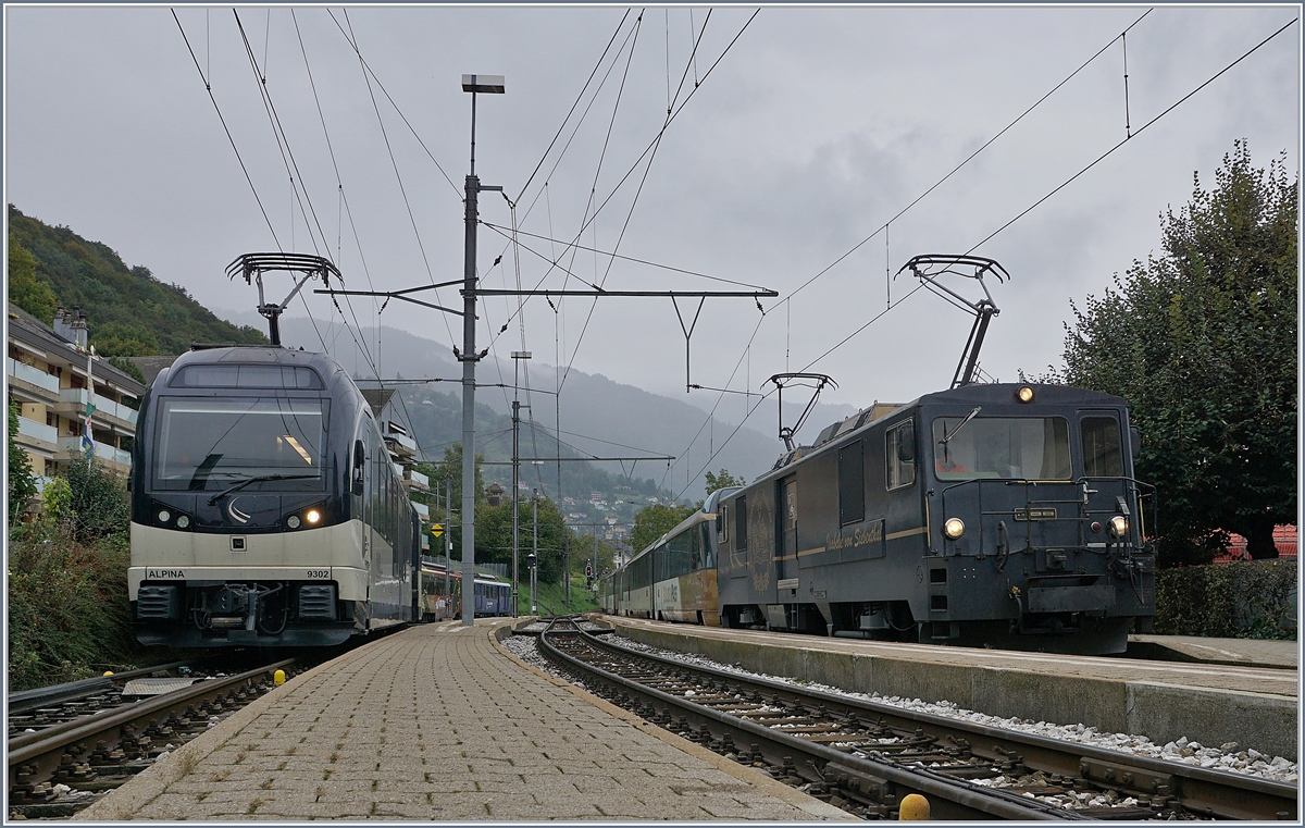Während in Chernex der MOB Alpina links im Bild rangiert, wartet die MOB GDe 4/4 6002 mit ihrem Panoramic Express auf die Abfahrt nach Montreux.

4. April 2019