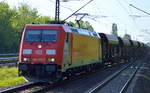 BR 185.3/583762/185-325-5-verlaesst-mit-einem-langen 185 325-5 verlässt mit einem langen Schüttgutwagenzug die Industrieübergabe Nordost am 19.05.17 Berlin-Hohenschönhausen.
