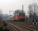 Im Gegenlicht: 111 010 mit dem RE 9 (Rhein-Sieg-Express) Aachen - K�ln - Siegen, hier am 17.03.2012 bei Betzdorf-Bruche.