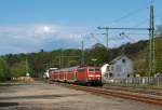 111 011-3 zieht den RE 9 (Rhein-Sieg-Express) Aachen - K�ln - Siegen in Richtung Siegen vorbei,  hier am 30.04.2012 in Mudersbach.