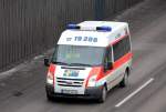 Aber auch die klassischen weien Fahrzeuge gibt es bei der Fa. ADG, hier ein Ford Transit Krankentansportfahrzeug am 31.03.10 Berliner Stadtautobahn Hhe Kaiserdamm. 