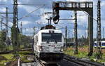 BELog Baustoffe- Entsorgung- Logistik GmbH & Co. KG, Langenau [D] mit der geleasten northrail Vectron Dual Lok   248 084  [NVR-Nummer: 90 80 2248 084-6 D-NRAIL] und einem Gannzug staubender Drehgestell-Hochbordwagen am 18.09.26 H�he Bahnhof Uelzen.