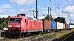 containerzuege/887545/db-cargo-ag-mainz-d-mit DB Cargo AG, Mainz [D] mit ihrer '145 056-8' [NVR-Nummer: 91 80 6145 056-8 D-DB], möglicherweise vermietet?? mit Containerzug am 07.07.25 Höhe Bahnhof Magdeburg-Neustadt.