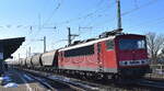 LDK - Leipziger Dampf KulTour Alexander Schröter, Leipzig mit ihrer  155 191-0   [NVR-Nummer: 91 80 6155 191-0 D-LDK] und einem Getreidezug am 18.02.25 Höhe Bahnhof Magdeburg-Neustadt.