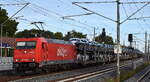  NeS - Netzwerkbahn Sachsen GmbH, Dresden [D] mit der leasten Akiem Lok '185 588-1' [NVR-Nummer: 91 80 6185 588-1 D-AKIEM] und einem PKW-Transportzug (fabrikneue SKODA Modelle) am 29.09.26 H�he Bahnhof Gl�wen.