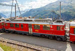 Der RhB ABe 4/4 III - 53  Tirano  Triebwagen am 06.09.2021 mit dem Bernina-Express (BEX) nach Tirano beim Halt in Alp Gr�m, davor war noch der Triebwagen RhB ABe 4/4 III 51  Poschiavo .