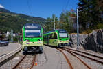 Zwei tpc AOMC/ACD Beh 2/6 meterspurige Triebzüge mit gemischtem Adhäsions- und Zahnradbetrieb vom Typ Stadler SURF stehen am 08 September 2023 im Endbahnhof der AOMC in Champéry (1.037